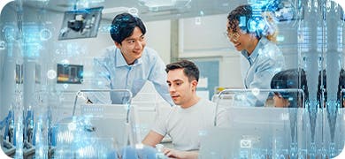 Image of a group of people interacting with a computer monitor to signify upskiling teams.