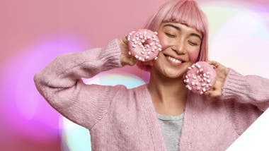 Image: Woman with pink hair and donuts, representing the Retail Evolution in Southeast Asia Consumer Packaged Goods - as featured in the whitepaper.