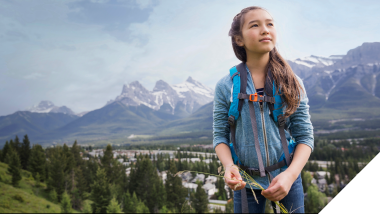 Image: Young Asian woman with mountains in the background, symbolizing hope for a better future in our 'Marketing a Better Future' Sustainability Report.
