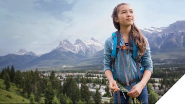 Image: Young Asian woman with mountains in the background, symbolizing hope for a better future in our 'Marketing a Better Future' Sustainability Report.