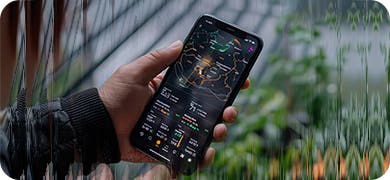 Image of a hand holding a mobile phone to signify investment in Dynamic Creative Optimization DCO.