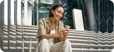 Image of a woman with short hair on her white mobile phone.