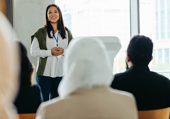 Image of a person presenting to a group of people