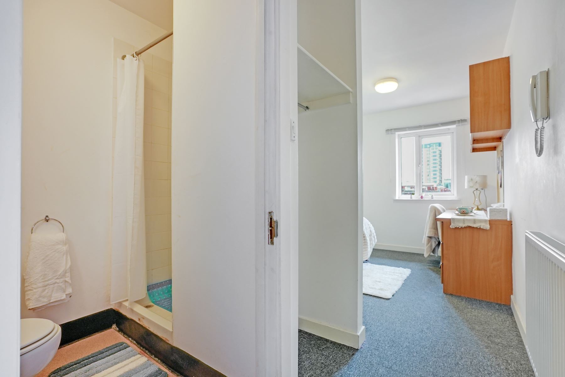 Corridor in room with en-suite to the left