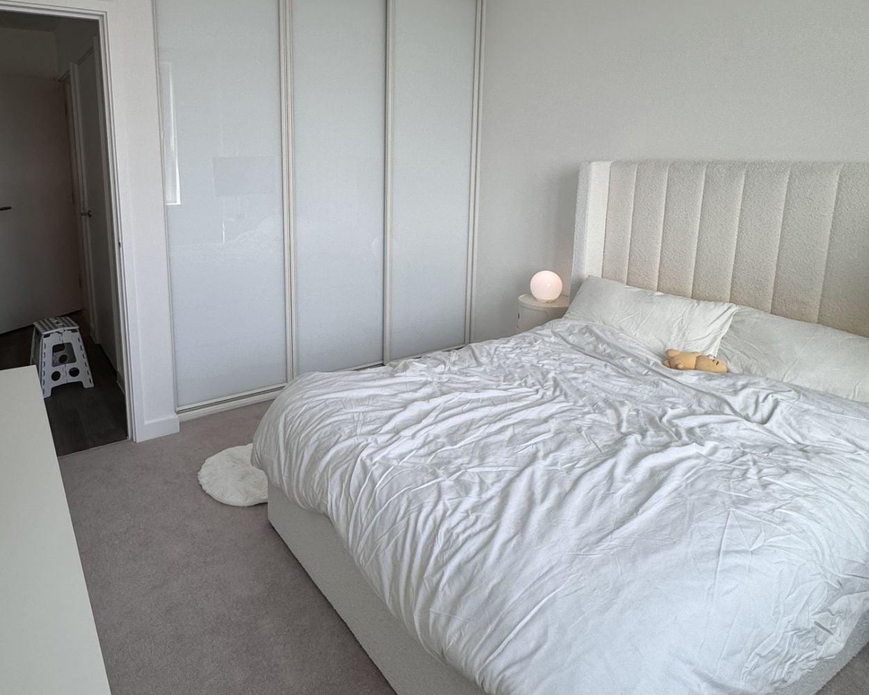 Photo showing the double bed and built-in wardrobe