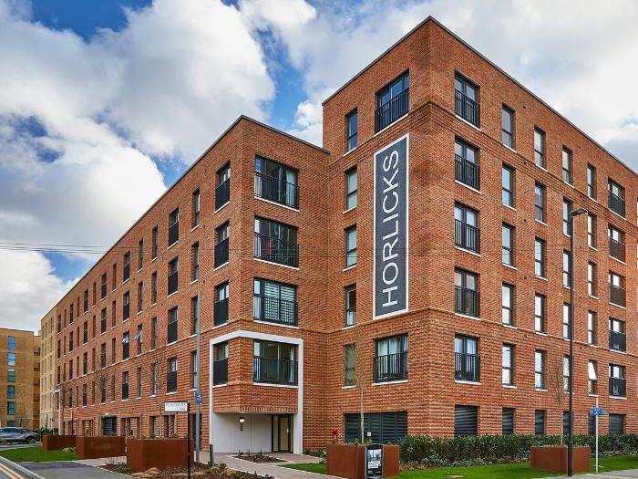 Exterior photo of entrance to The Warehouse apartment block at Horlicks Quarter