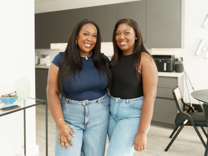 Baaba and Josephine pose for a picture in their kitchen