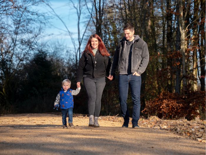 Family walking through a forest