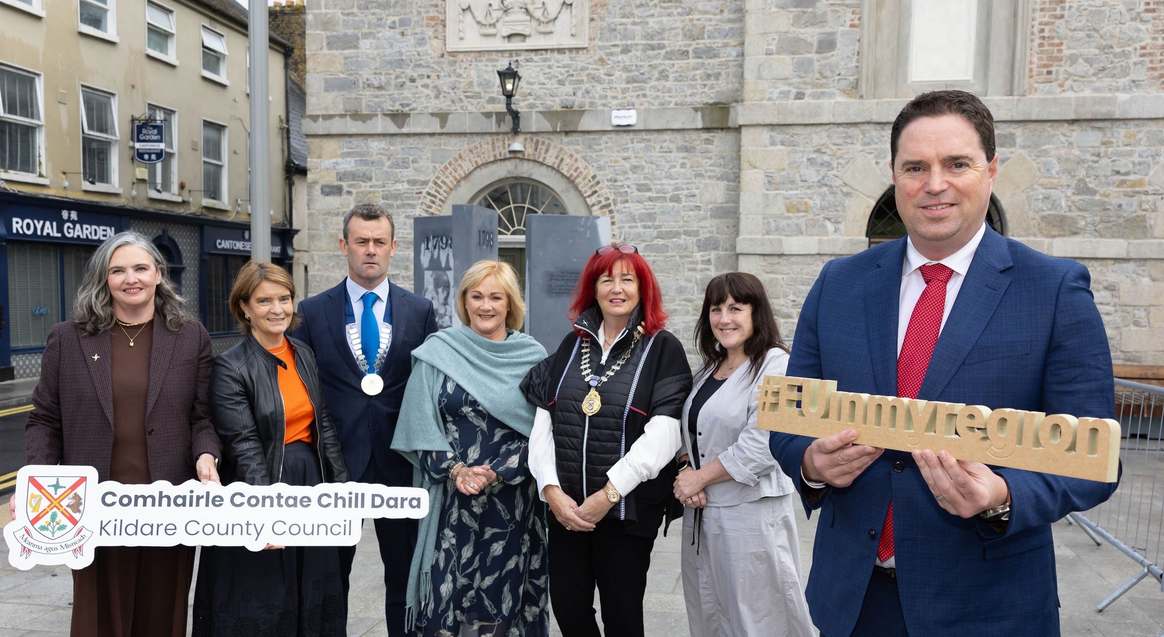 Stakeholders pose in Emily Square.