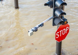 A stop sign in flood water