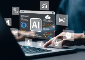 Човек пише на лаптоп с 3D изображения на знаци и символи над клавиватурата