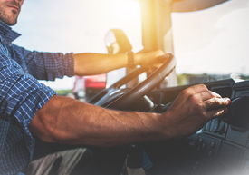 A man driving a truck