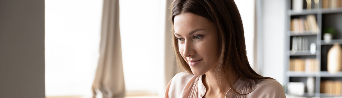 A woman looking down at something