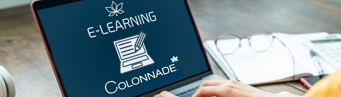 komputer, na którego ekranie widać stronę do logowania do serwisu e-learningowego Colonnade 