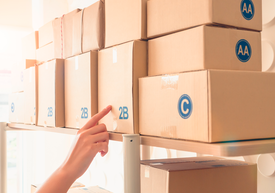 A person taking a box from a warehouse