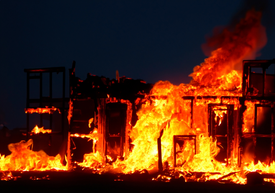 A building on fire at night