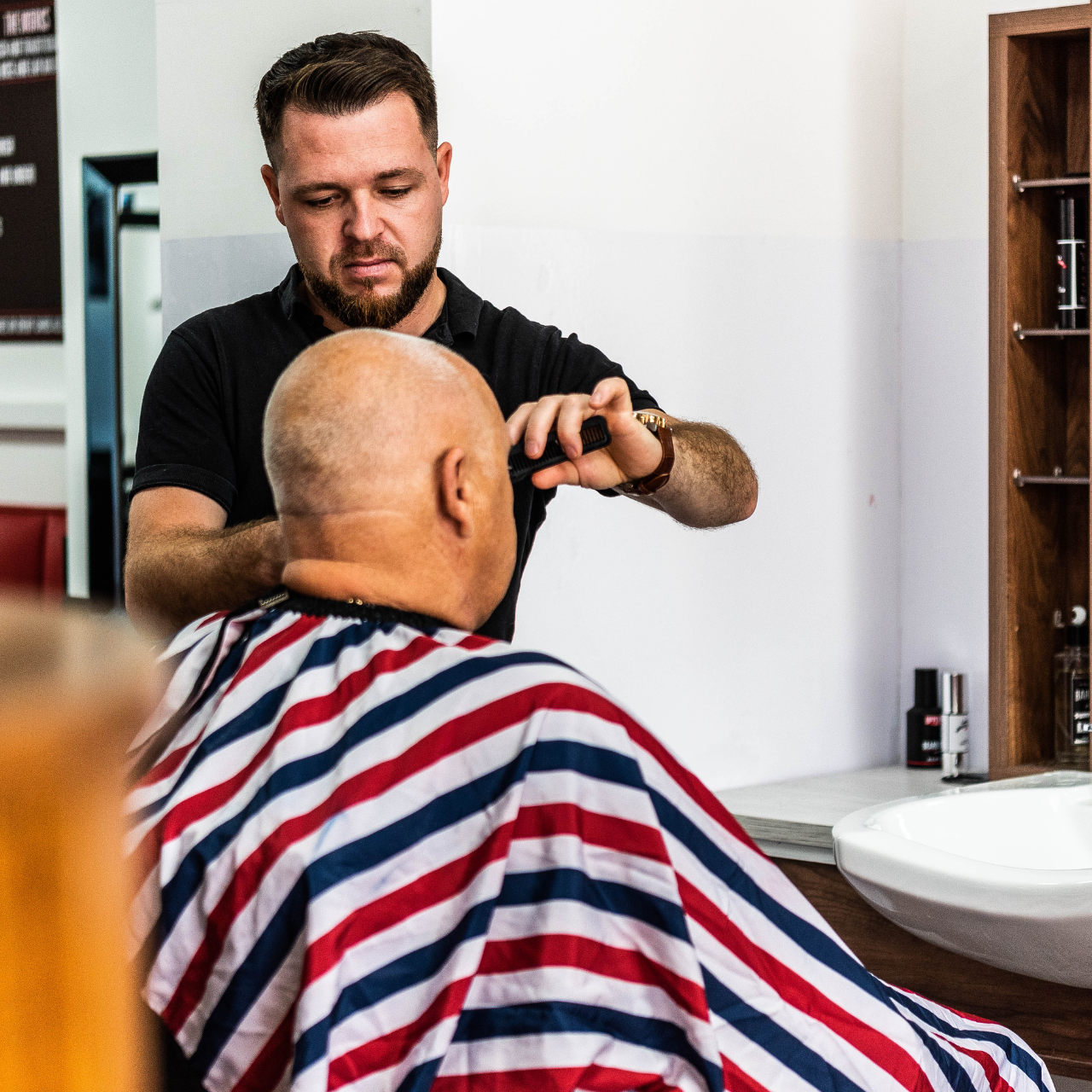 photo of someone cutting hair 