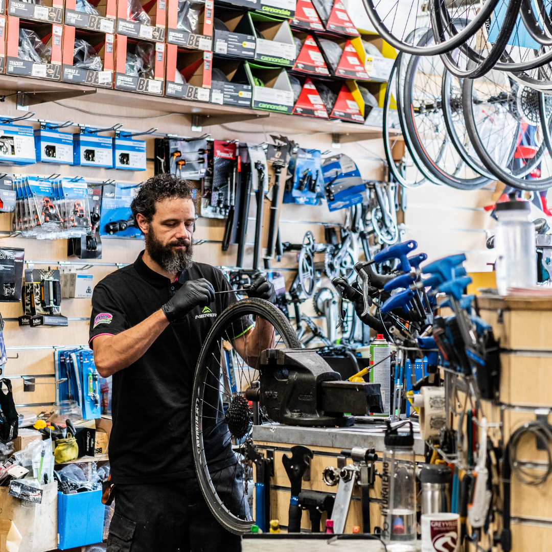 photo of someone fixing a tyre 