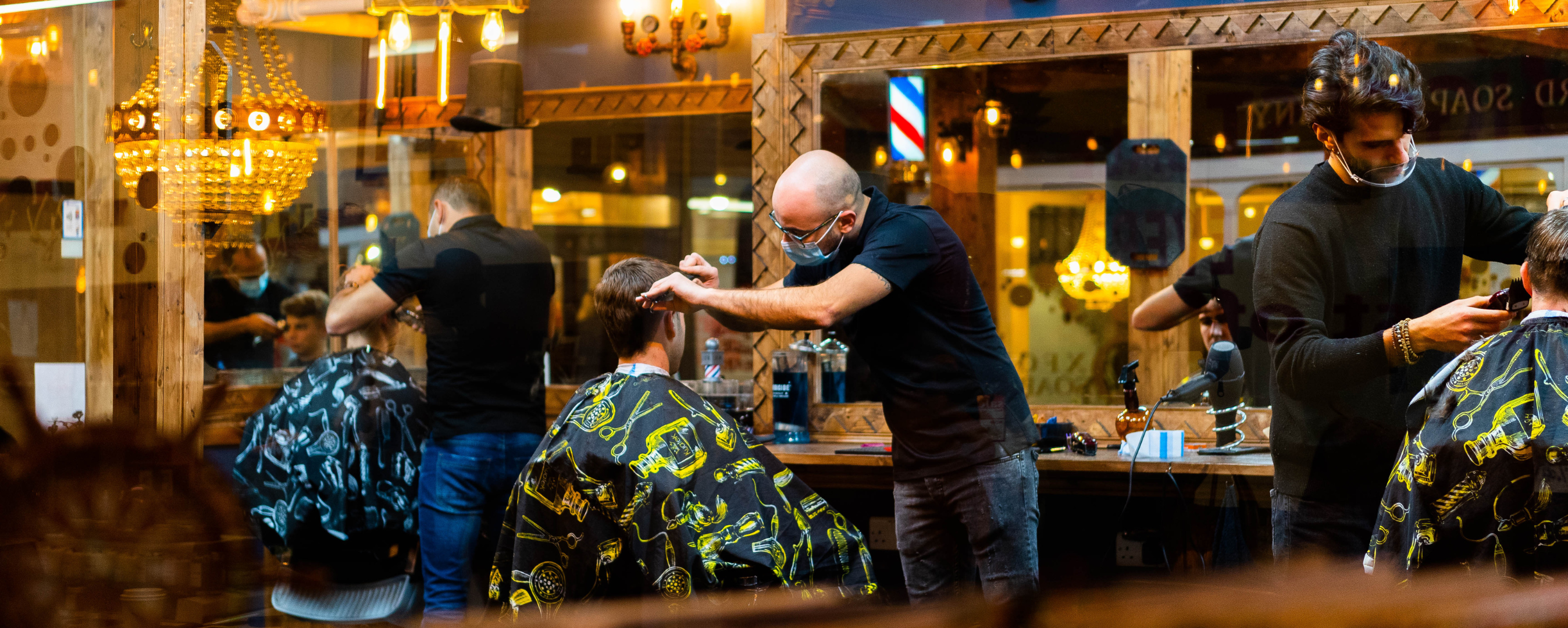 photo of people cutting hair 