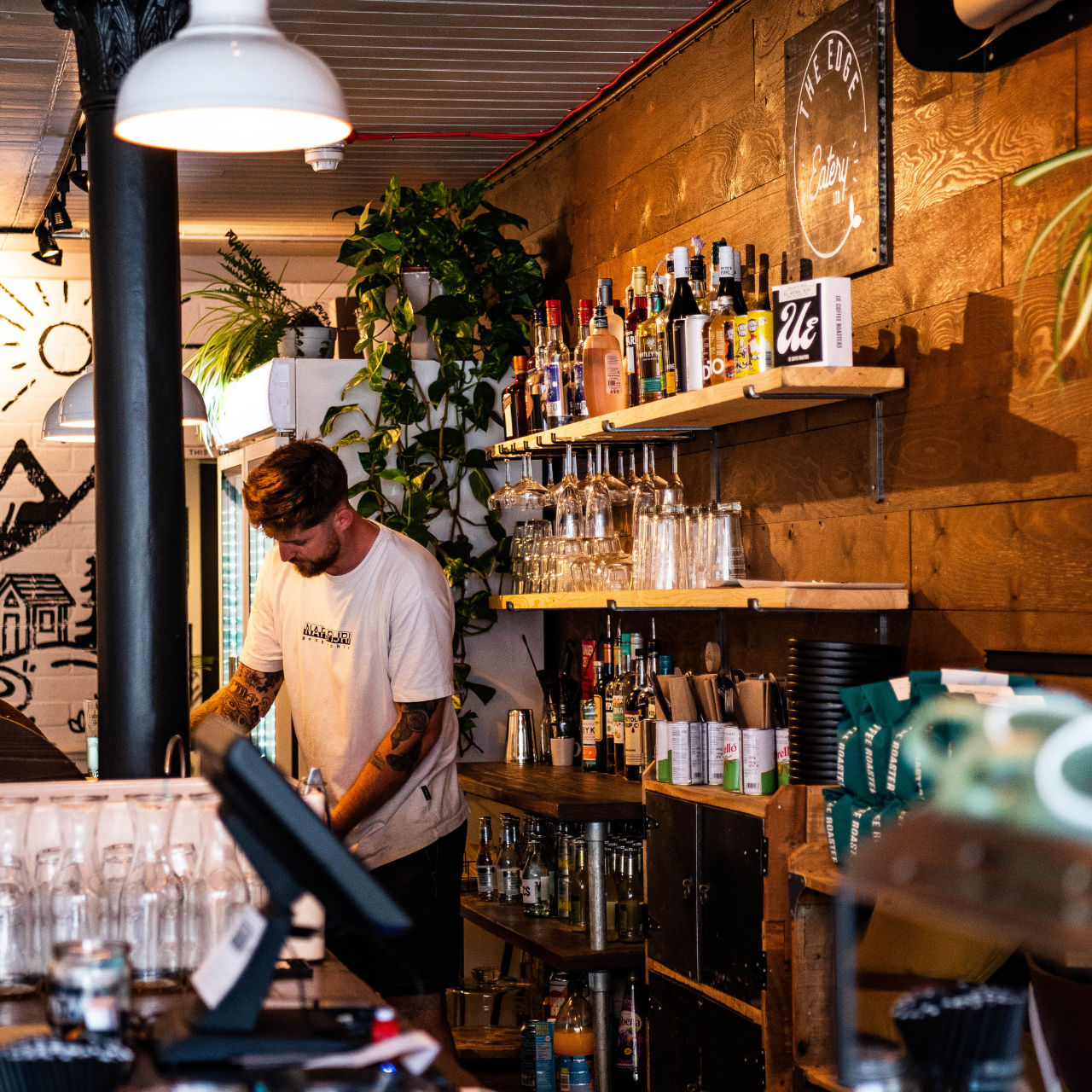 photo of someone behind a bar 