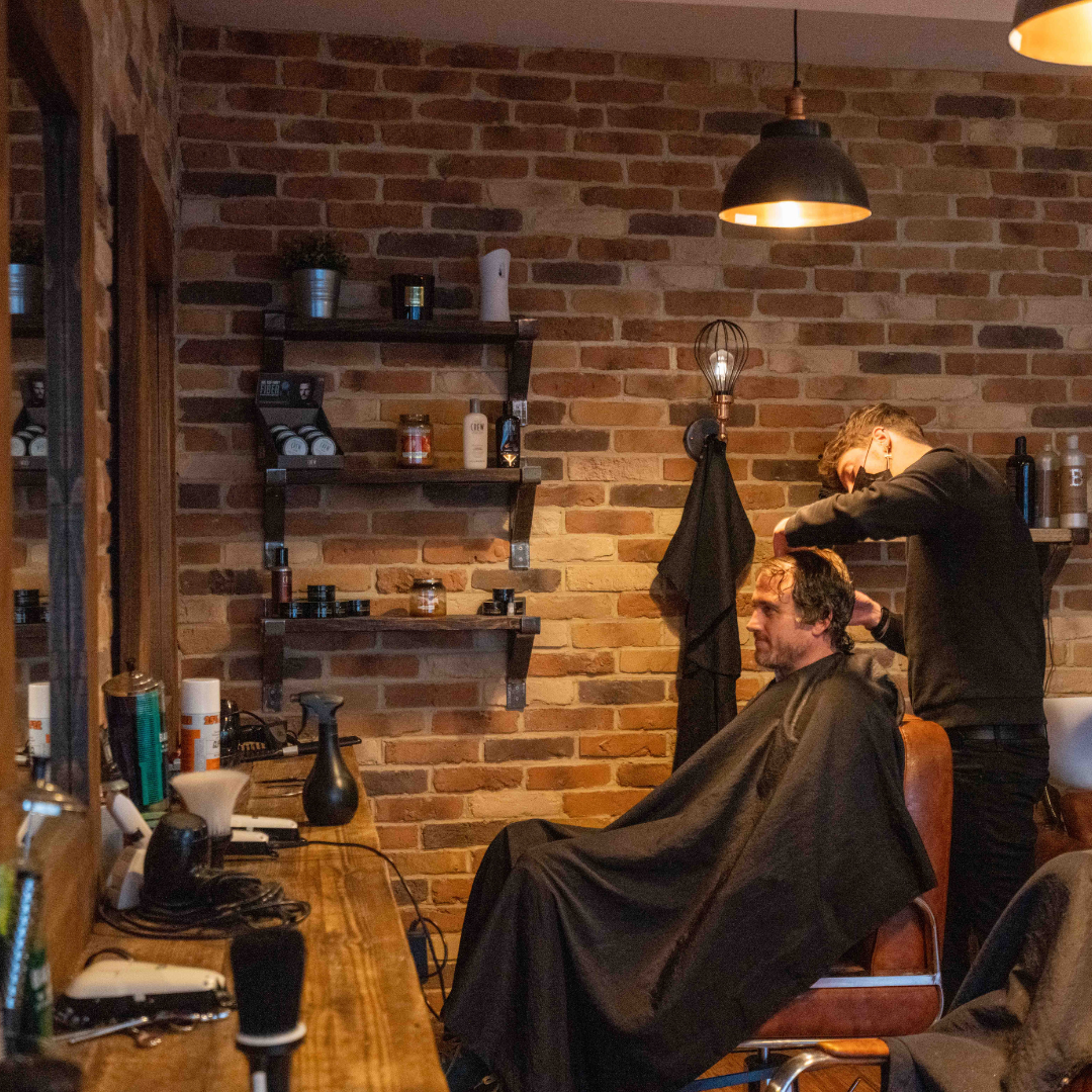 photo of someone cutting hair 