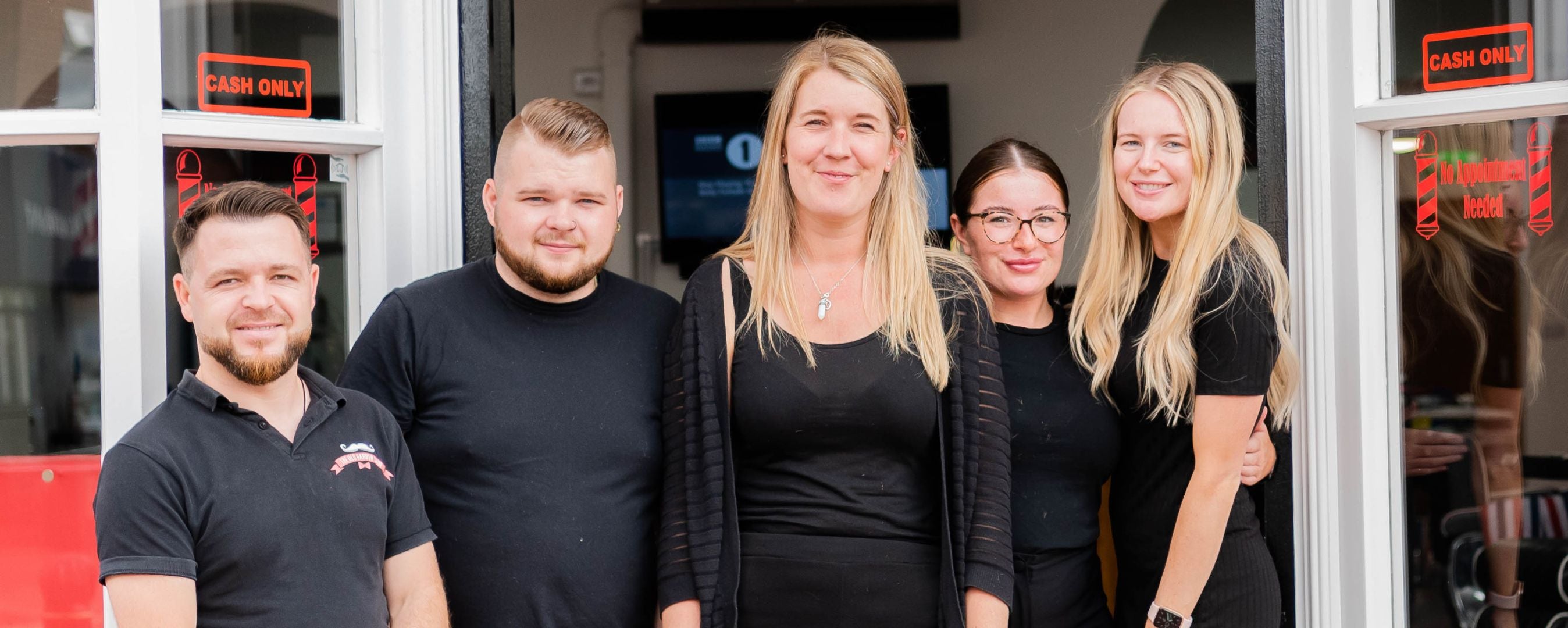 people standing outside a shop