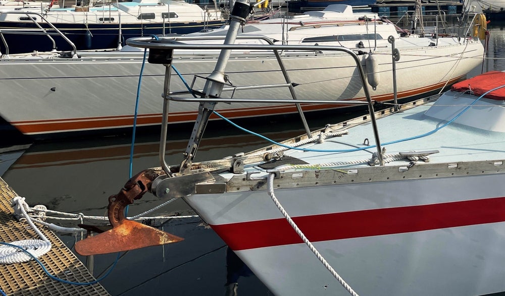 Close up of two boats on a marina.