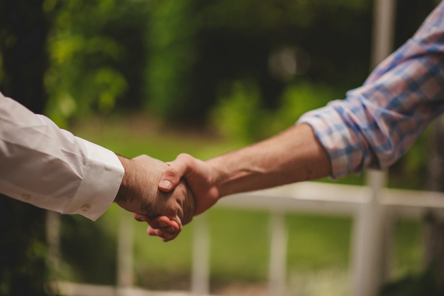 Image of two people shaking hands, taken by Erika Fletcher for Unsplash