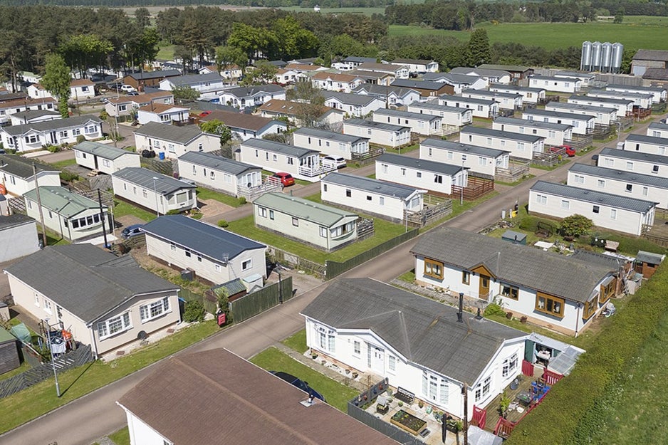 Ariel shot of a holiday park, depicting rows of holiday homes. 