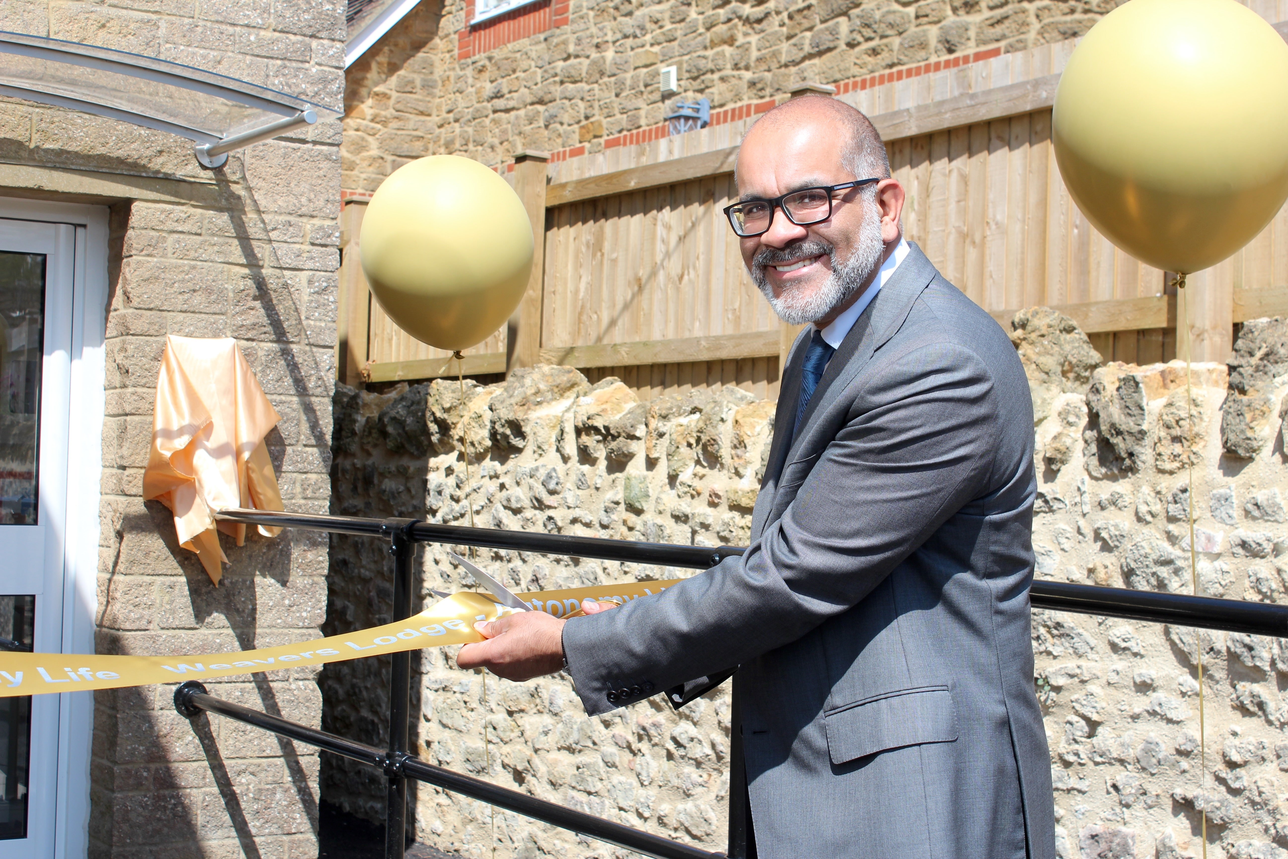 The grand opening of Weavers Lodge in Somerset, with Lord-Lieutenant of Somerset, Mr Mohammed Saddiq, cutting the ribbon