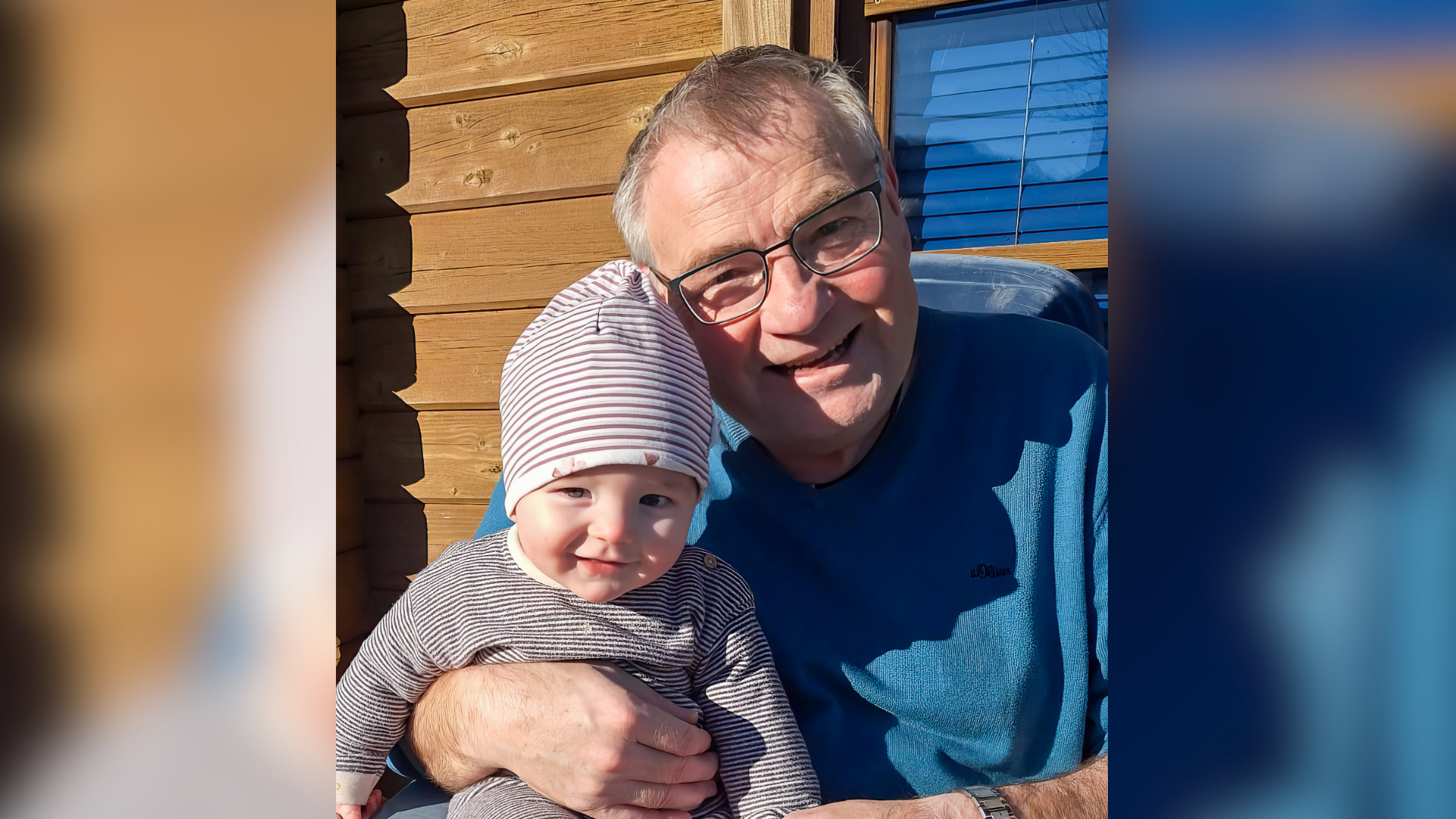 Ein Mann hält ein Baby