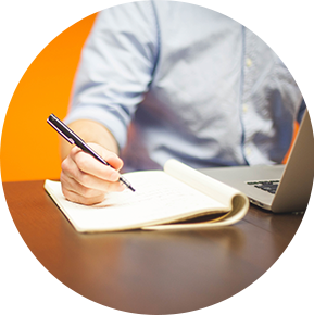 placeholder image of a person holding a pen