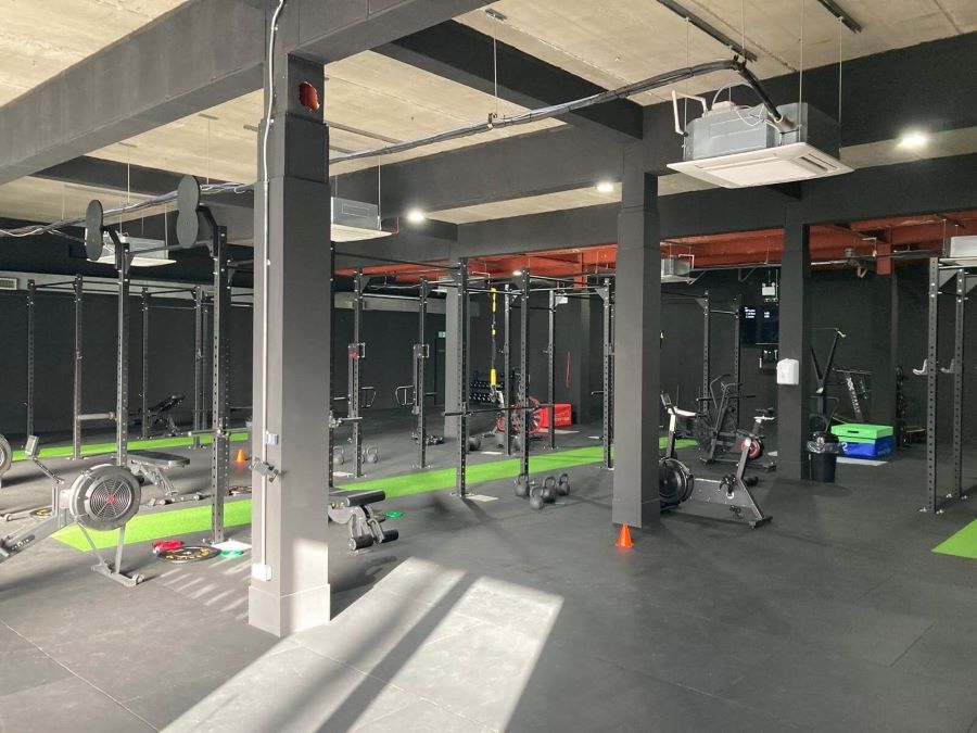 The finished gym complete with equipment and green mats