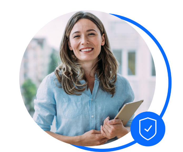 Female in blue shirt with long brown hair holding a clipboard towards the camera