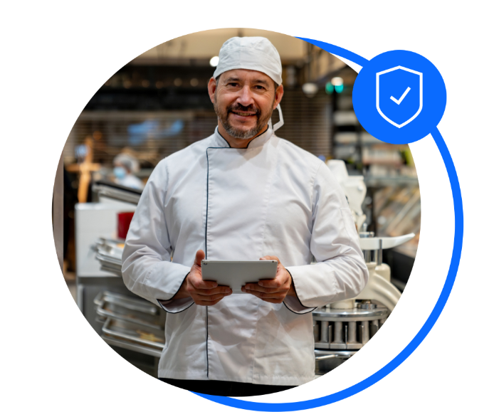 Male caterer stood in kitchen