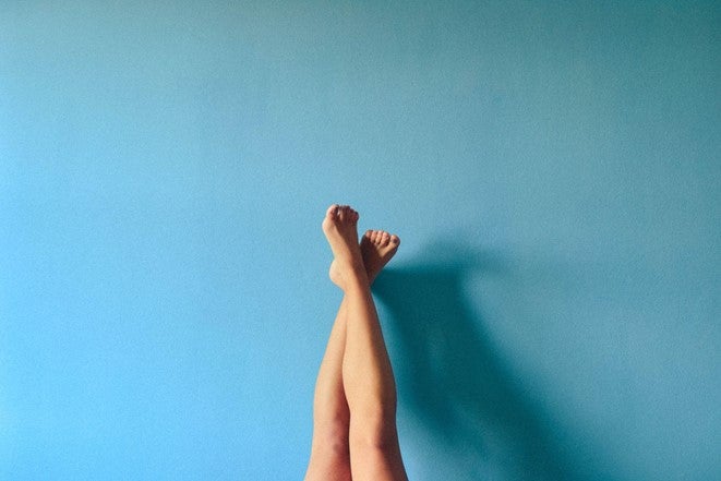 Waxed leg leaning up against a blue wall in a Wolverhampton waxing salon