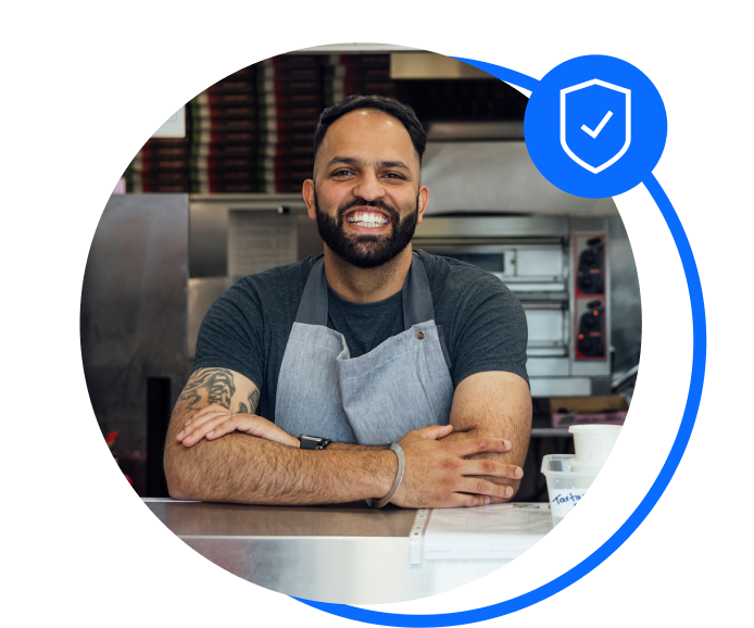 Fish and chip shop owners leaning on counter