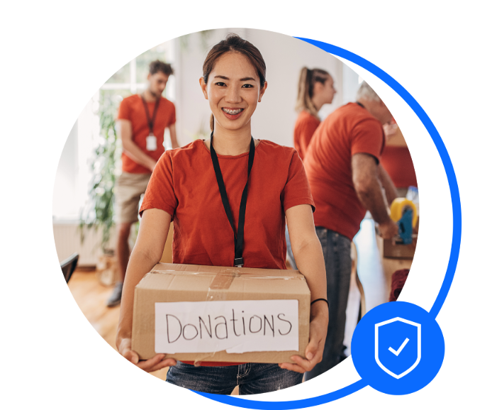 Female charity worker holding a donations box 