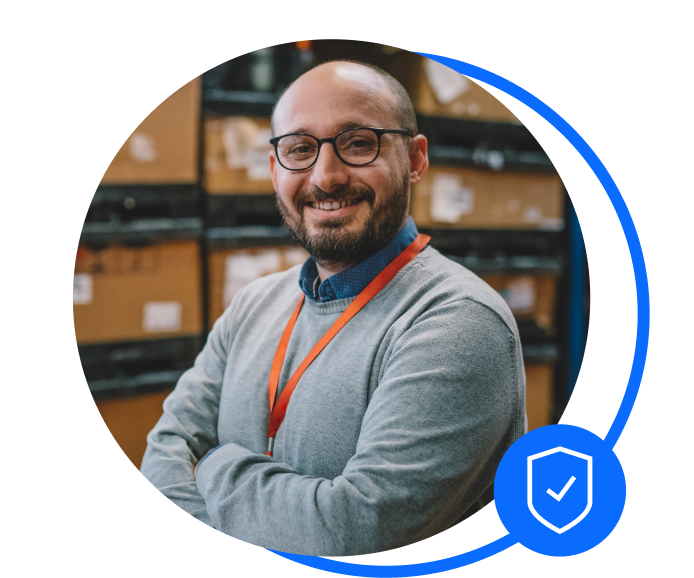 Warehouse owner stood in warehouse