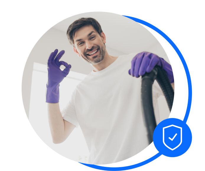 Male carpet cleaner with gloves on