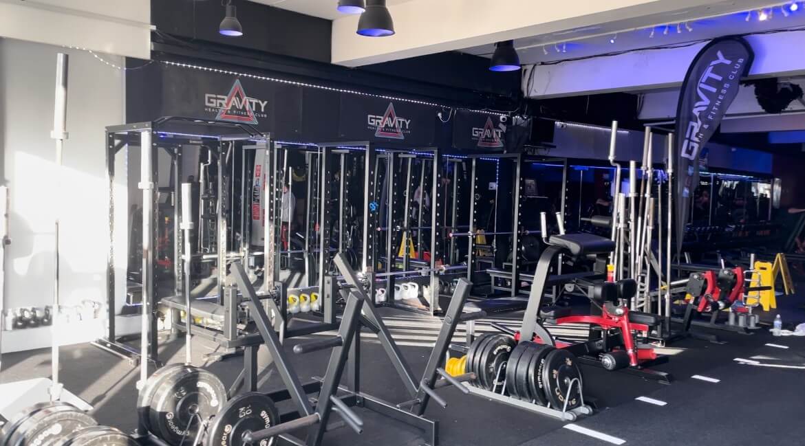 Gym equipment including bars and weight plates at Gravity Gym in Wirral.