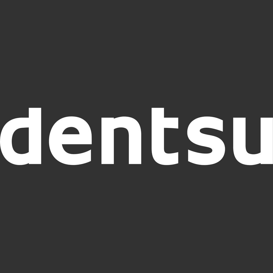 White dentsu logo on a black background