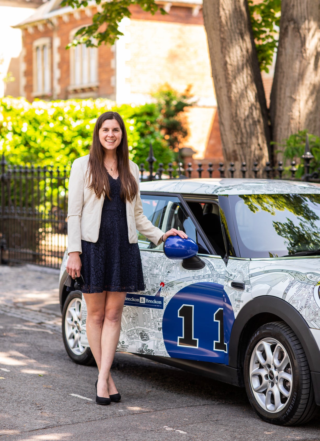 Estate Agent next to a Breckon & Breckon car