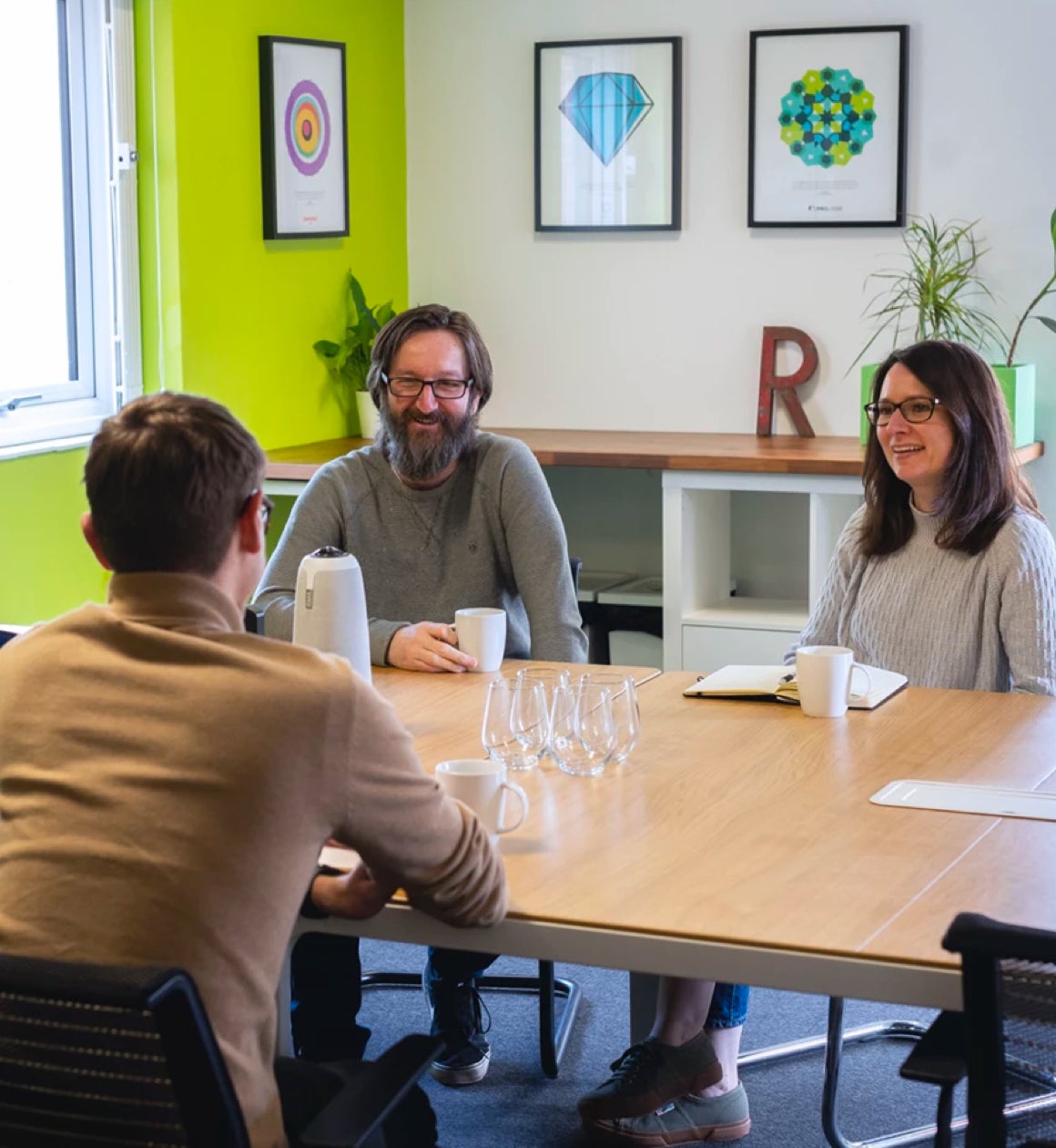 Team discussion in a Green Workspace meeting room