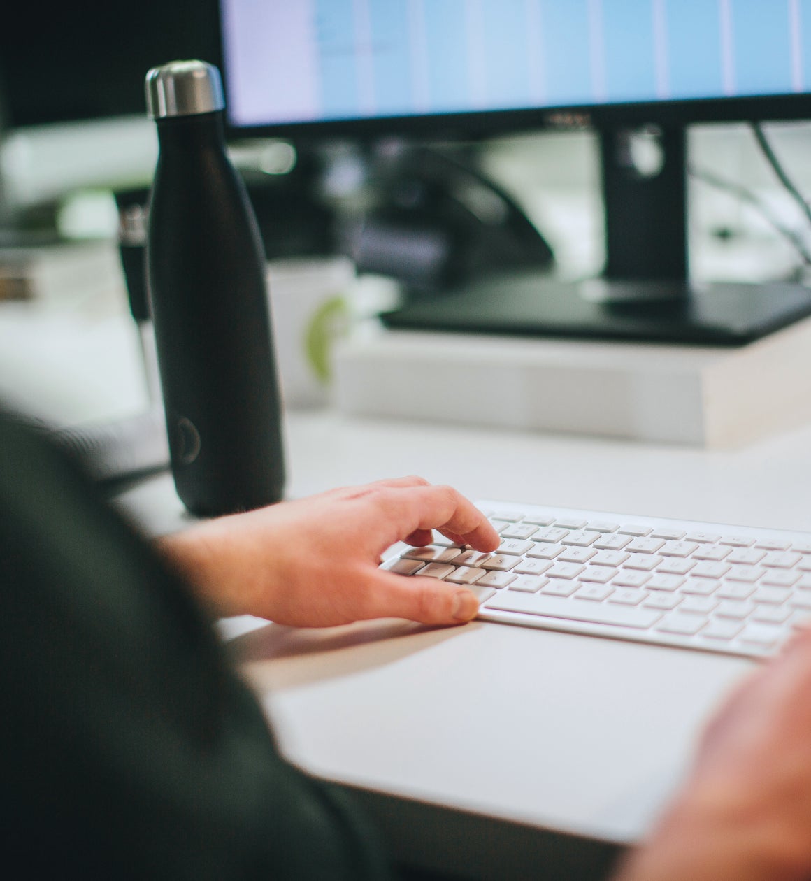 Ridgeway team member working at a desktop computer