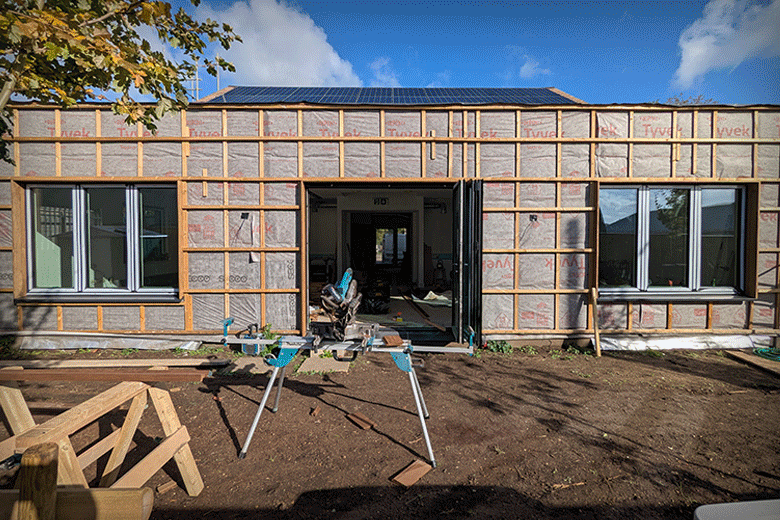 Animated .gif showing the outside of the building being cladded in Thermowood