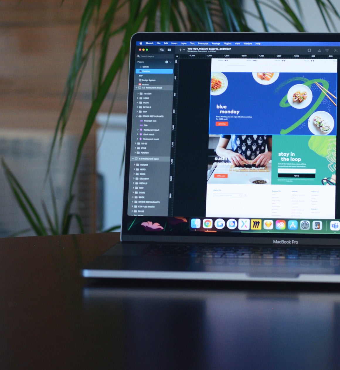 YO! website designs on a laptop