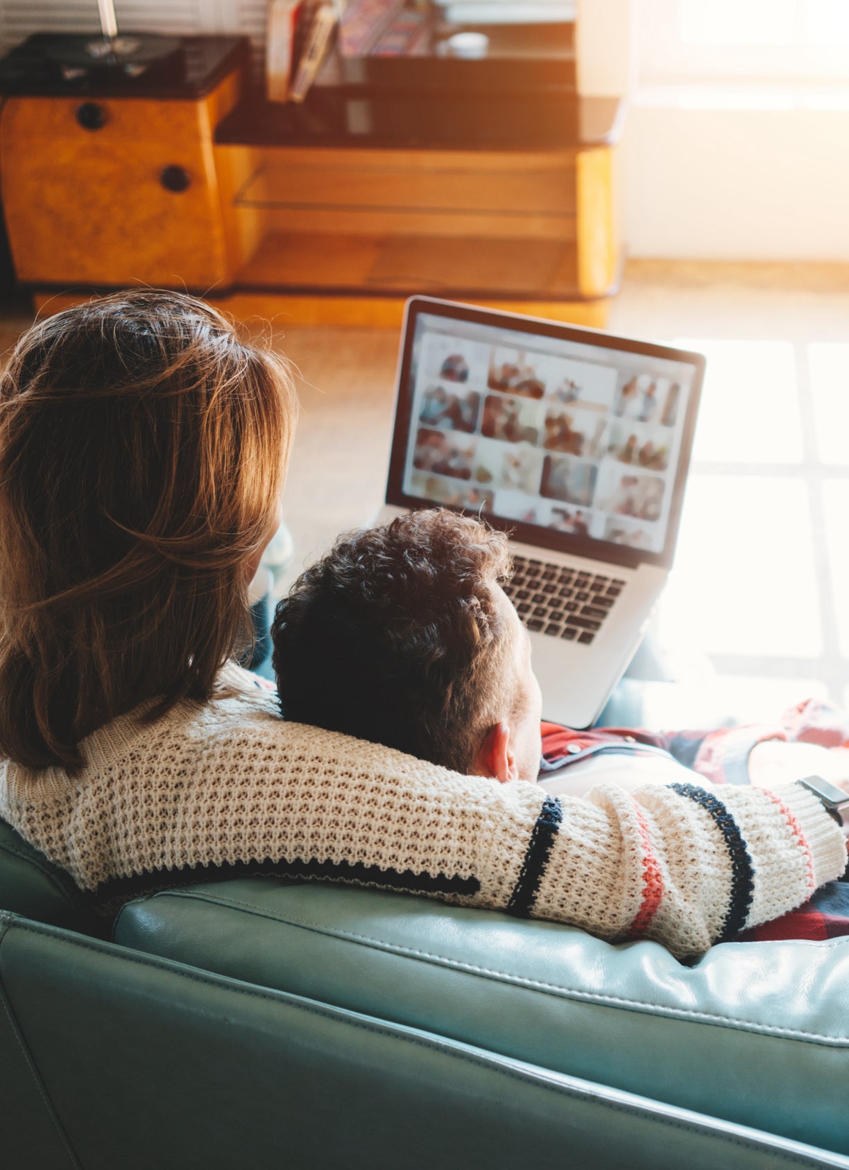 A couple in a well lit living room