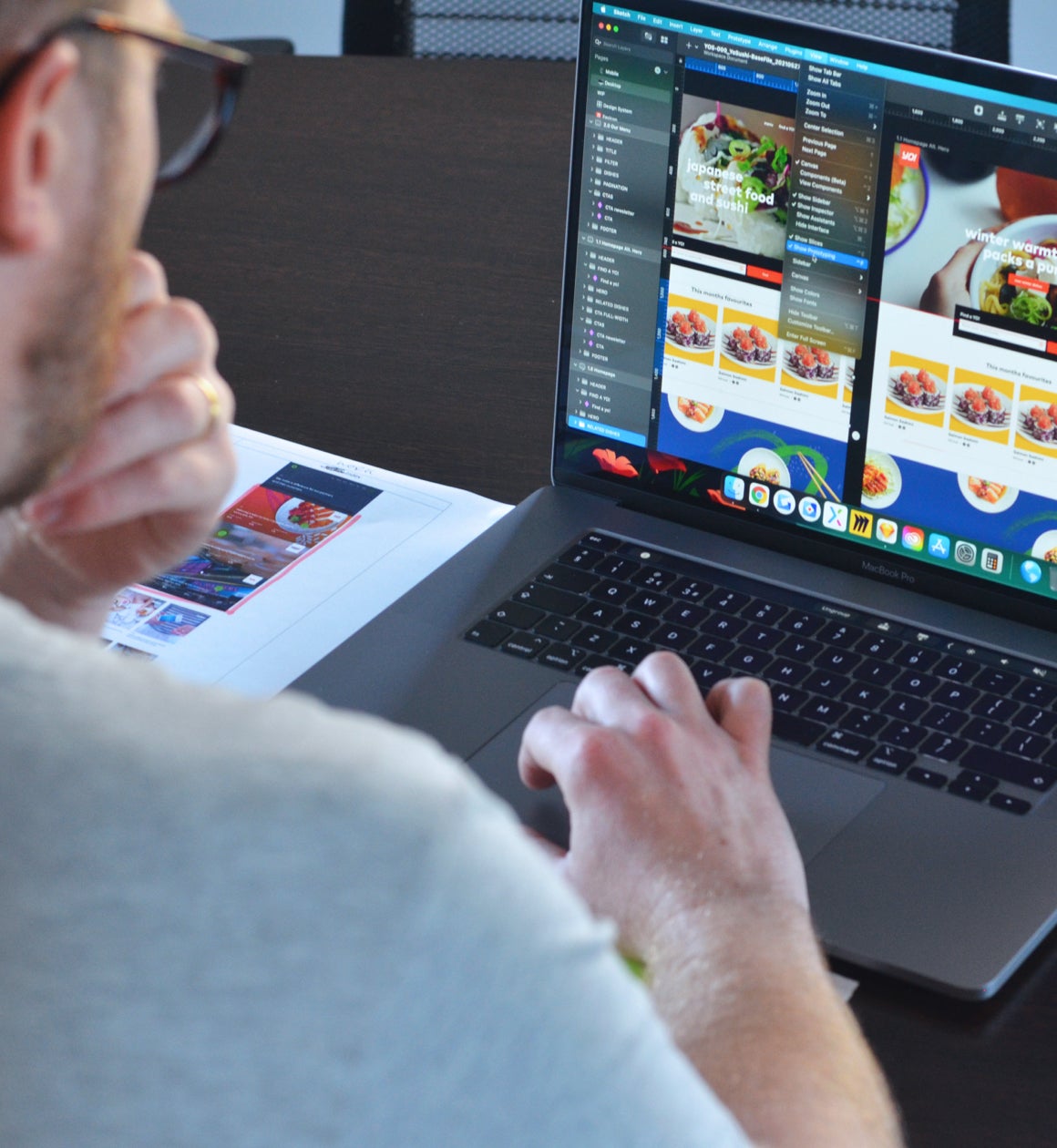 Designer working on YO! page designs