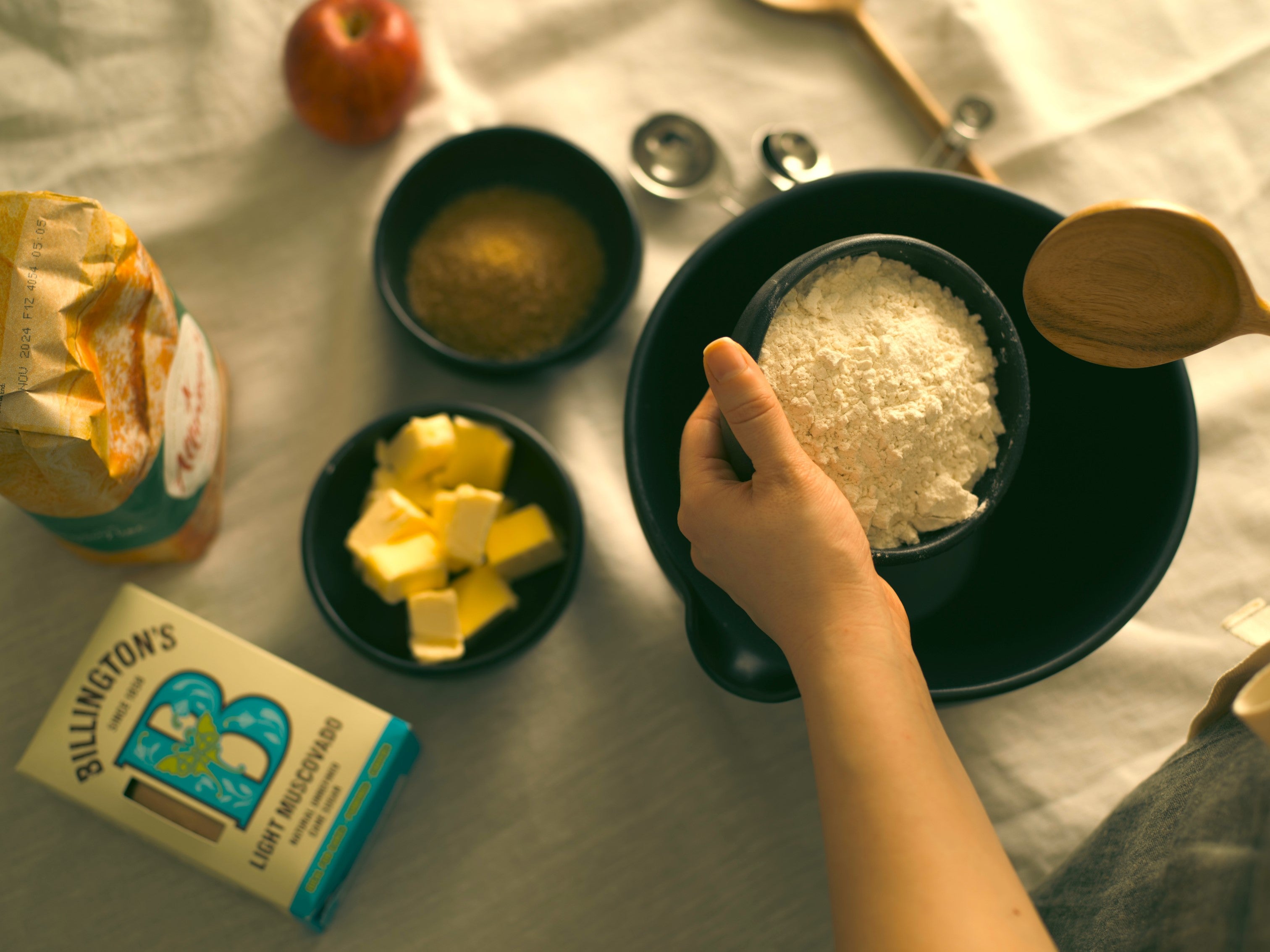 Stirring together the ingredients for an apple crumble